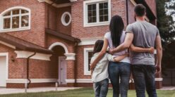 family looking at their home